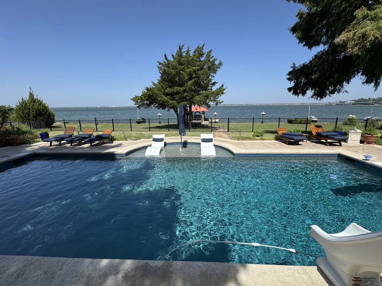 A lakefront pool and spa looking out over Lake Ray Hubbard in Rockwall, Texas